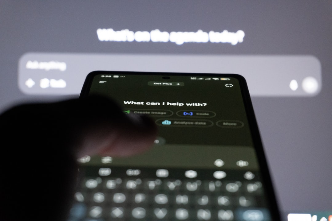 GitHub Copilot徹底解説:AIペアプログラマーで開発効率を劇的に向上 - Person typing on smartphone with ai chatbot on screen.
