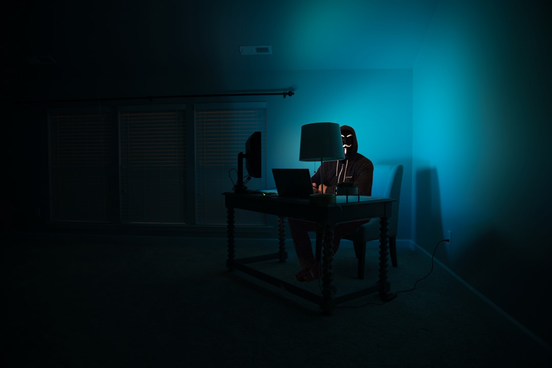 【Kiro】最新アップデート！エクスポート機能と推論レベル調整を解説 - Pictured - a man at a computer disguised as an anonymous hacker wearing a Guy Fawkes mask.